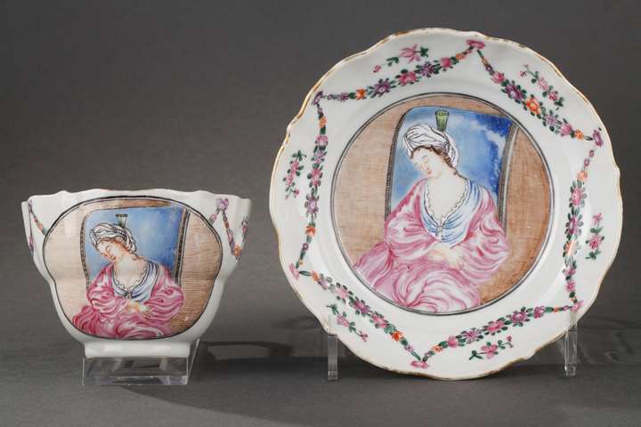 Cup with handle and saucer decorated with European decor